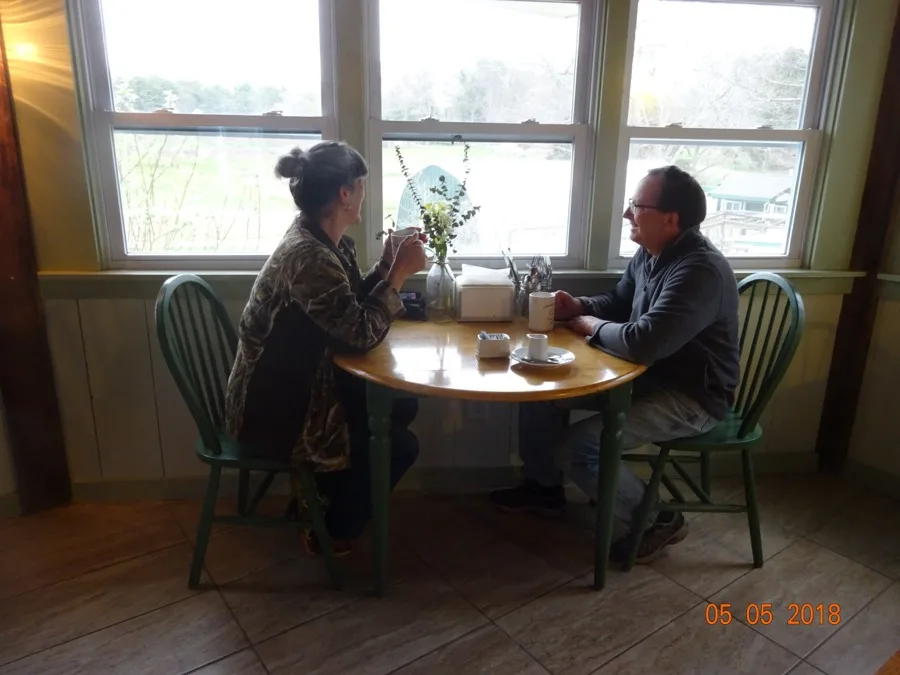 Guests dining at a table inside the Buffalo Jump Café