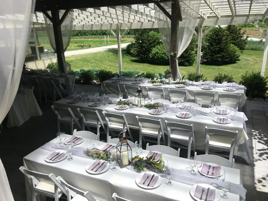 A wedding tablescape set for a reception at Coonamessett Farm